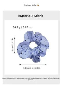 Detailed view of blue striped fabric scrunchie with black hearts and product sizing info