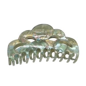 Elegant large marble textured hair claw clip in iridescent green and cream cloud design