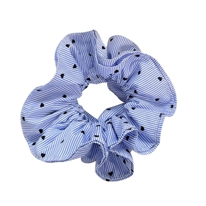 Blue and white striped scrunchie with black heart pattern in a classic pleated design