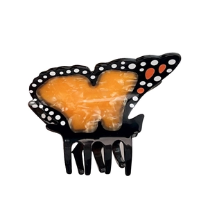 Pince à cheveux papillon élégante avec motifs en acétate orange et accents noirs