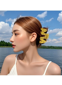 Macro view of wave-edged yellow hair claw clip with cartoon duck pattern on back head