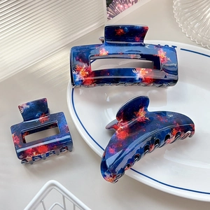 Three-piece set of blue fireworks pattern acetate hair claws in square and curved shapes