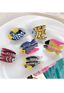 Close-up of colorful acetate fish hair claws in diverse marine patterns and vibrant shades