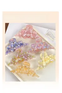Details von fünf Acetat-Blumenhaarklammern mit Marmortextur in verschiedenen Farben