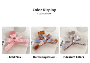 Close-up of bow claw clips in pink marble, Dunhuang color, and flowing light patterns