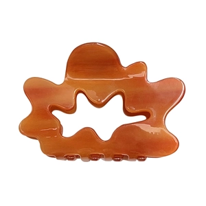 French cloud hollow hair claw in amber marble acetate with stylish wavy design