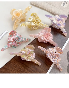 Collection of large acetate 3D rose flower hair claws in various marble and pastel colors