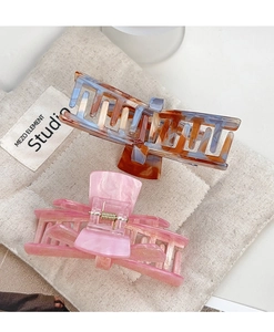 Detail showing marble texture and tortoise pattern on large acrylic hair claw clips