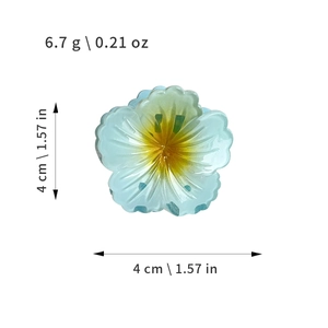 Blue plumeria hair claw clip with yellow center and size measurements for beach styling