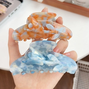 Chic acetate tulip hair claws in marble orange and blue flower design for women