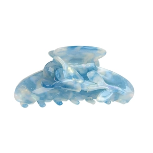 Blue tulip tulip claw clip with marbled acetate finish and subtle glitter texture