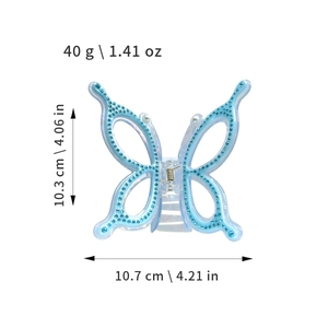 Oversized butterfly hair claw with blue rhinestones and dimensions 10.7x10.3cm