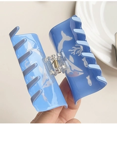 Blue ocean theme hair claw clip with white whale patterns and transparent texture