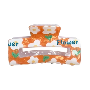 Orangefarbene florale Haarklammer mit Blumenmuster und blauem Flower-Schriftzug