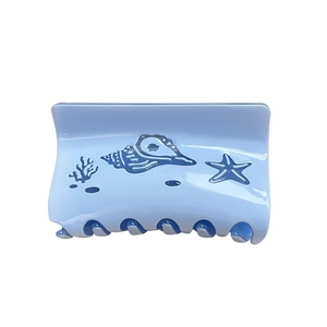 Ocean-themed light blue square hair claw clip with coral and seashell prints