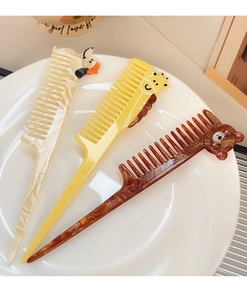 Detailed view of cartoon animal long handle hair combs in duck, giraffe and bear styles