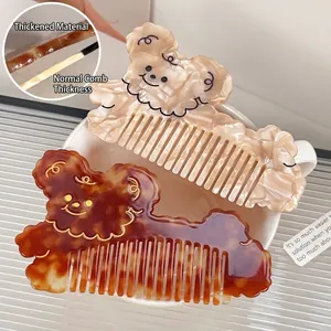 Cute bear-shaped acetate hair comb in amber and cream marble finish with thick material