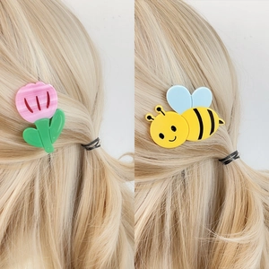 Cute cartoon animal hair clips featuring pink tulip and yellow bee designs on hair