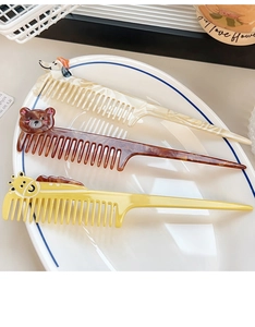 Detailed view of cartoon animal combs with marble patterns in a white porcelain dish