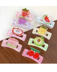 Detail view of 8-piece fruit-themed hair claws with marble texture acrylic designs
