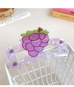 Detail of a purple grape square hair claw clip with glossy finish and leaf design