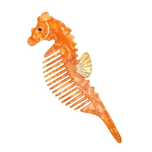 Cute seahorse shaped hair comb with orange marble texture and creative yellow fin design