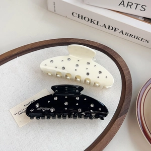 Elegante set de pinzas para el cabello negras y crema con diamantes de imitación
