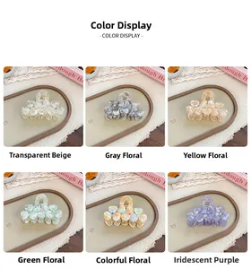 Detail of flower hair claws with rhinestones in acetate and diverse floral patterns