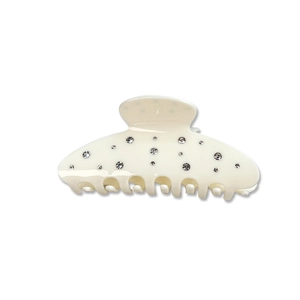 Elegant cream-colored hair claw clip with sparkling rhinestones in a minimalist design