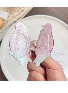 Close-up of fruit series hair claw showing the durable metal spring and matte pink texture