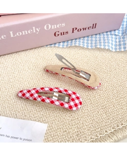 Detail view of red gingham fabric BB hair clips for women in a cute pastoral style