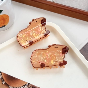 Cute Capybara hair claws in glossy acetate material for stylish women's hair styling