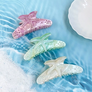 Starfish acrylic hair claw clips with rhinestones in pink, green, and white colors