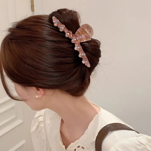 Haarklammer aus Acetat in Rosa mit schillernden Steinen für elegante Hochsteckfrisuren