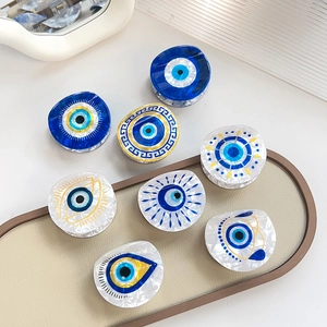 Collection de pinces à cheveux Mauvais Œil en acétate perlé avec motifs bleus et dorés
