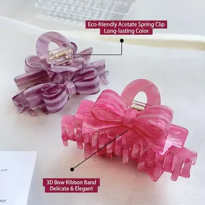 Elegant 3D bow hair claw clip made of lilac and peach acetate with marble texture