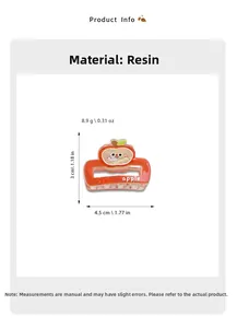 Detail of orange resin hair claw with cartoon apple ornament and dimensions