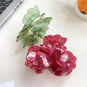 Pinces à cheveux élégantes en acétate avec trèfle et papillon serties de strass colorés