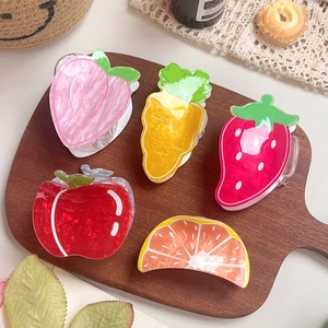 Cute fruit and vegetable hair claws featuring apple, peach, and carrot designs