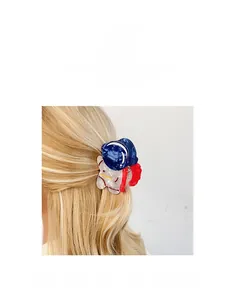 Detail view of a tricolor acrylic hair claw clip for women's modern hair styling