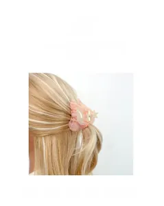 Detail of pink marble textured acetate shell hair claw clip styled on blonde hair