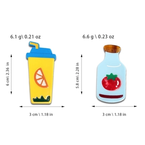 Cute cartoon enamel pins featuring yellow lemon tea and blue tomato juice bottle designs