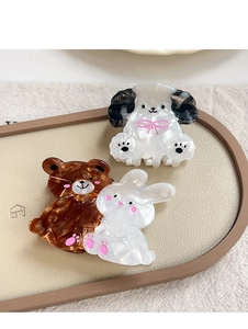 Detail of cute animal claw clips in acetate including dog, bear and rabbit shapes