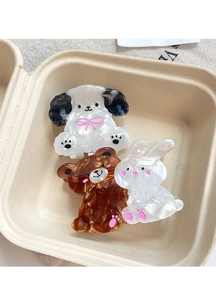 Close-up of acetate animal hair claws including puppy, bear, and rabbit with bow details