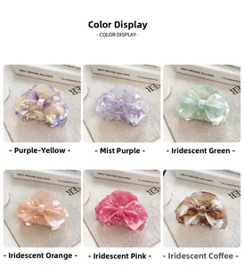 Macro detail of various marble texture acetate bow hair claws in six vibrant colors