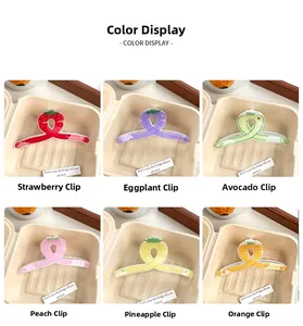 Détails de six pinces à cheveux aux formes de fruits colorés comme fraise et avocat