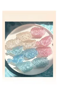 Close-up of ocean-themed whale and seashell hair claw clips with rhinestone details