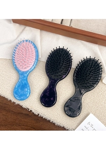 Three acetate hair brushes with marble patterns and air cushion massage bristles