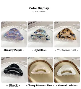 Detailed grid of hollow triangular acetate hair claws in six varied marbled patterns