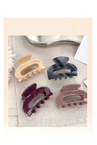 Lot de quatre pinces à cheveux en acétate en beige, marbre, violet et marron